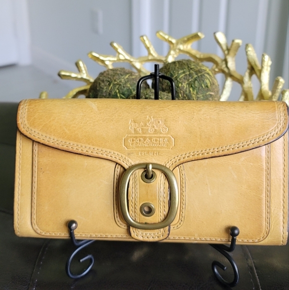 Coach Handbags - Coach Bleeker Tan Leather Buckle Clutch With Hot Pink Interior Gold Hardware